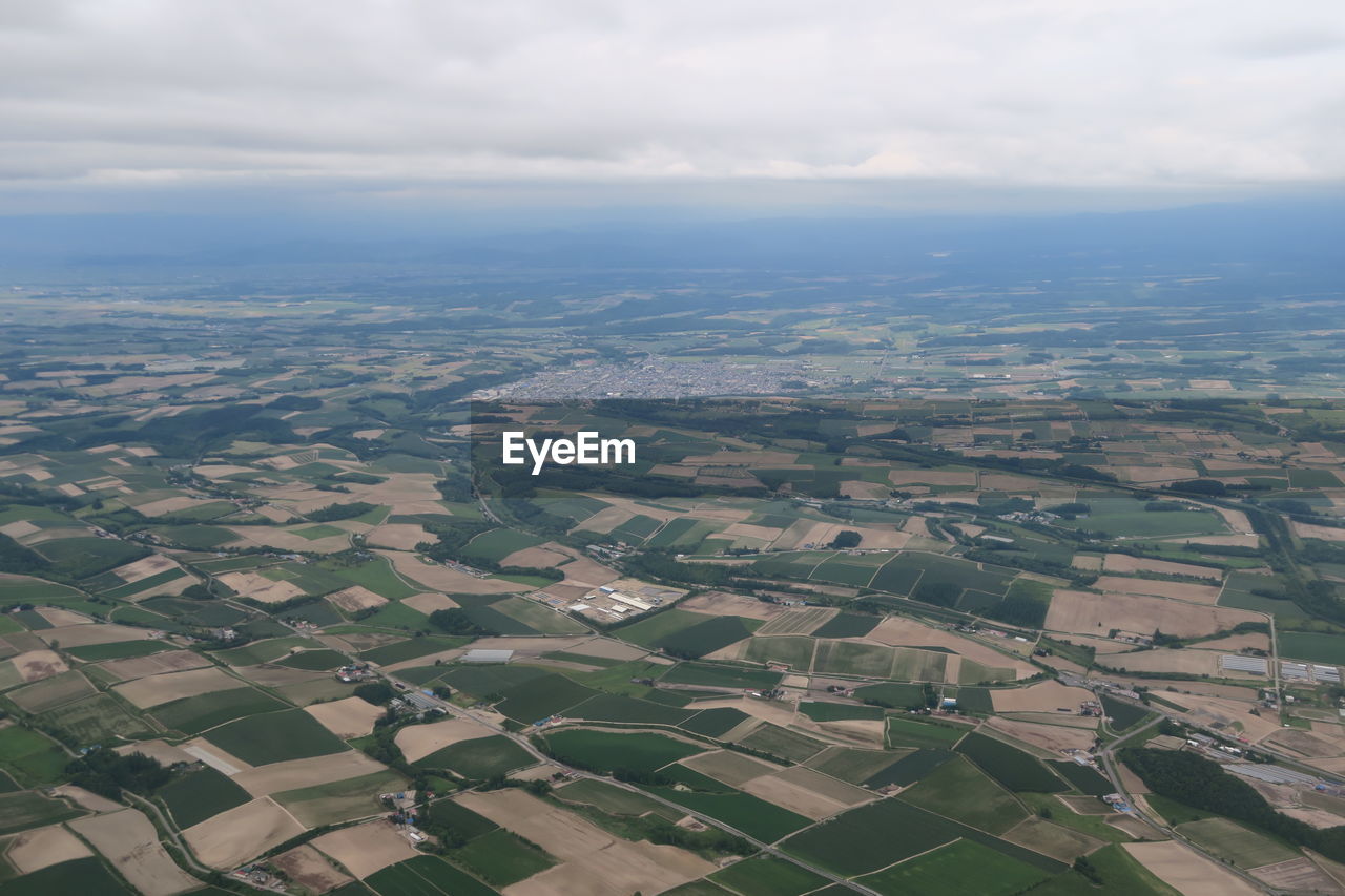 High angle view of buildings in city against sky