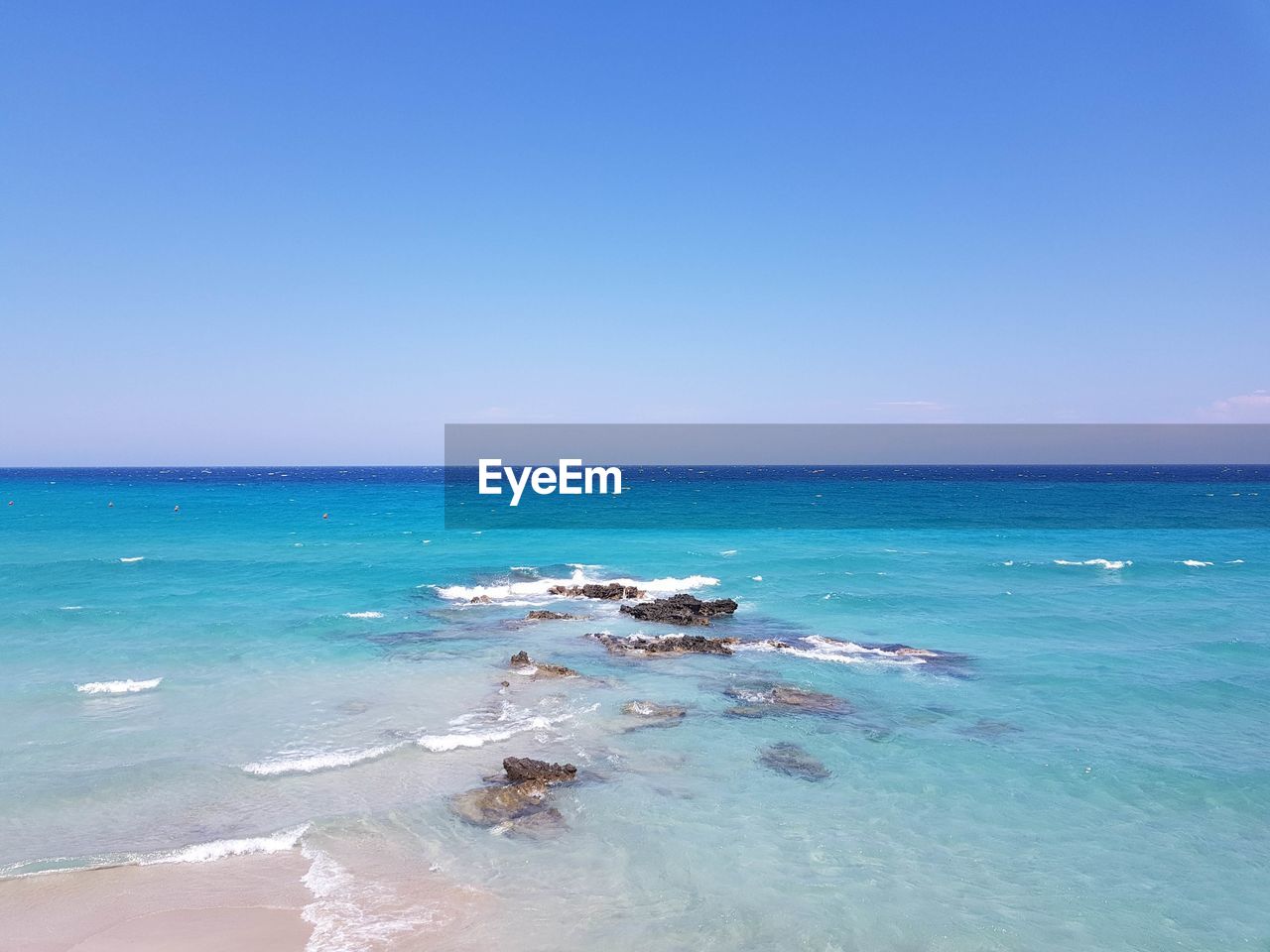 SCENIC VIEW OF BEACH AGAINST CLEAR BLUE SKY