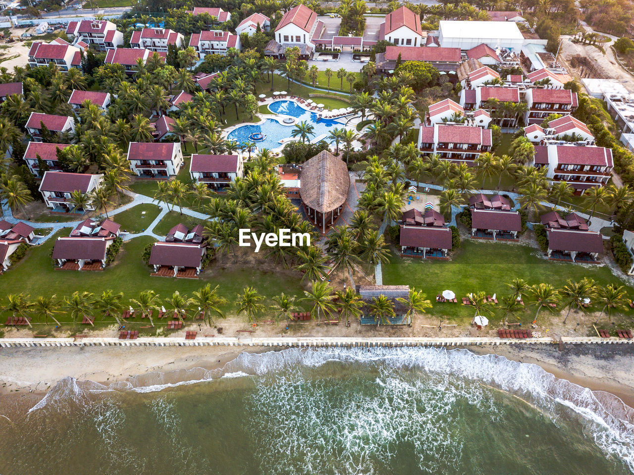 High angle view of swimming pool by buildings in town