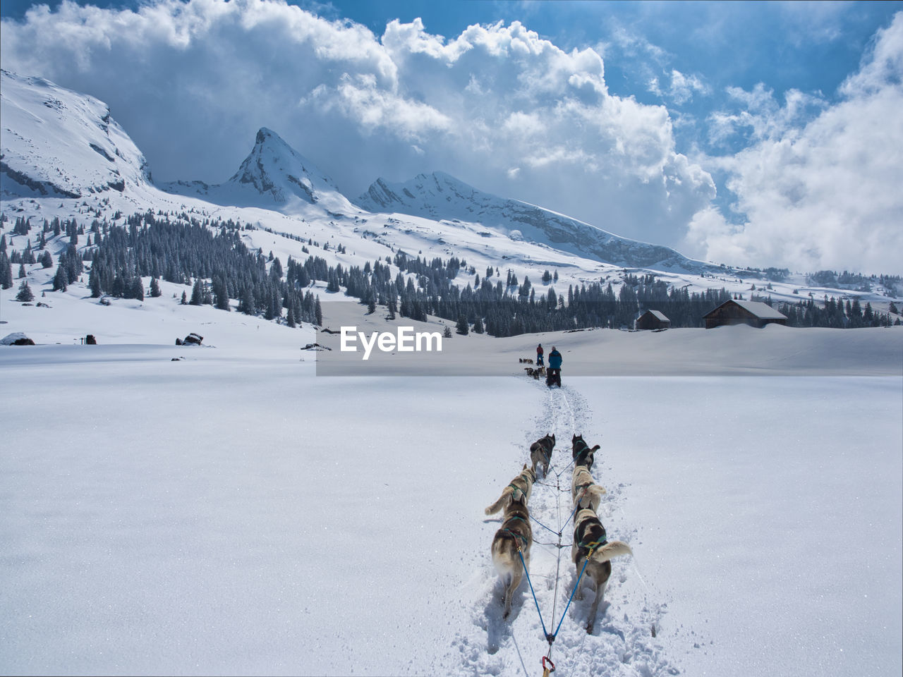 Scenic view of snow covered mountains against sky