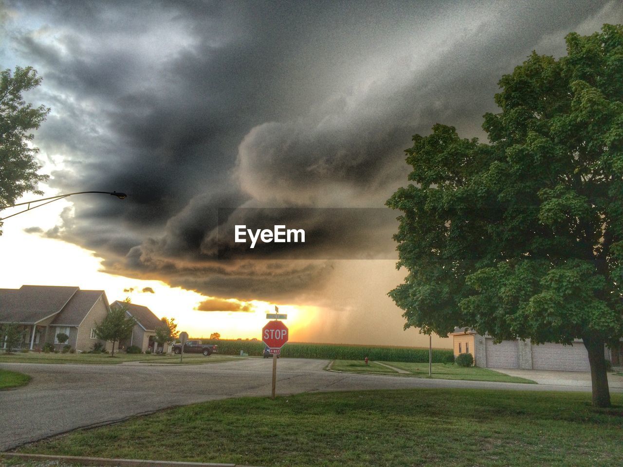 VIEW OF ROAD AGAINST CLOUDY SKY