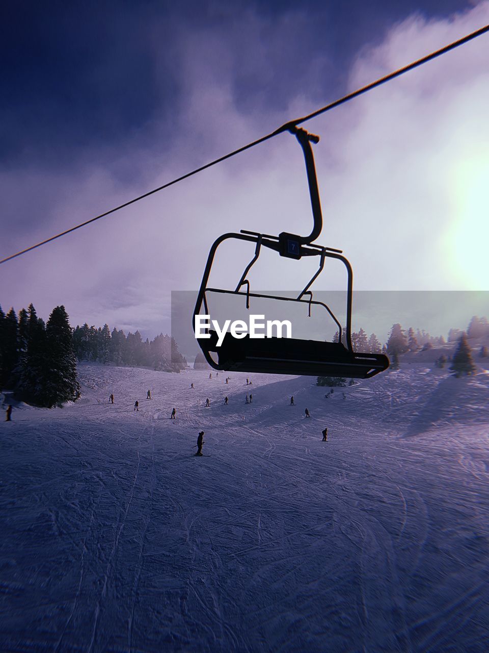 SKI LIFT ON SNOW COVERED FIELD