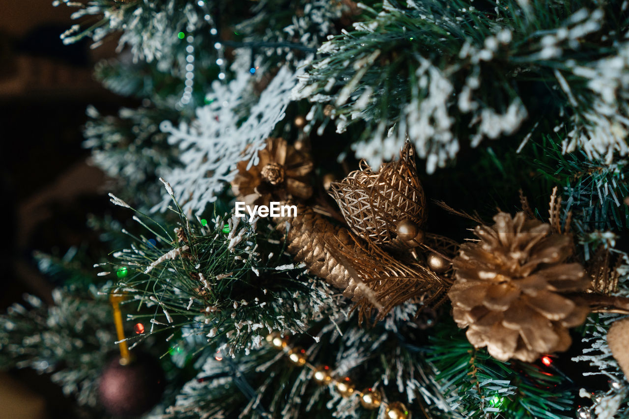 Decorated christmas tree with balls, beads, baubles.