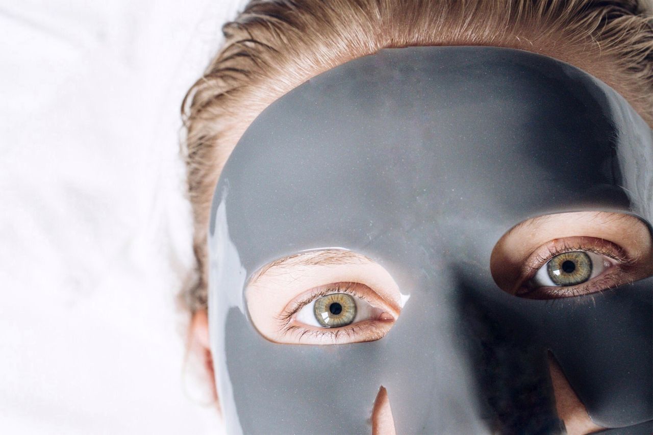 Close-up portrait of woman wearing facial mask