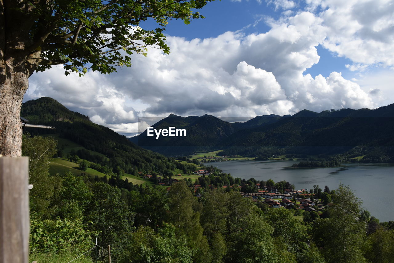 Scenic view of schliersee lake against cloudy sky