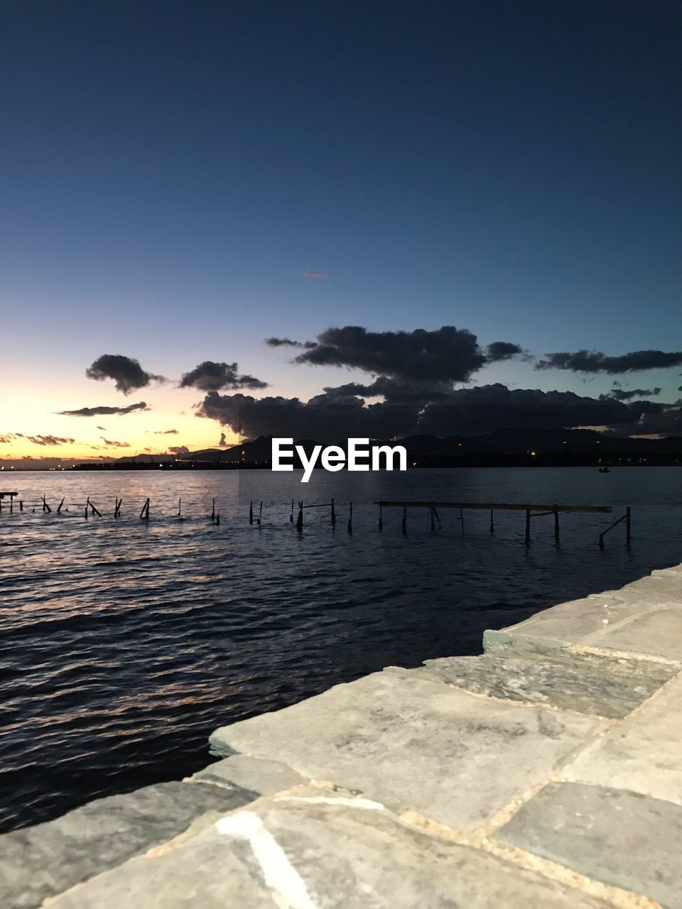 SCENIC VIEW OF SEA AT SUNSET