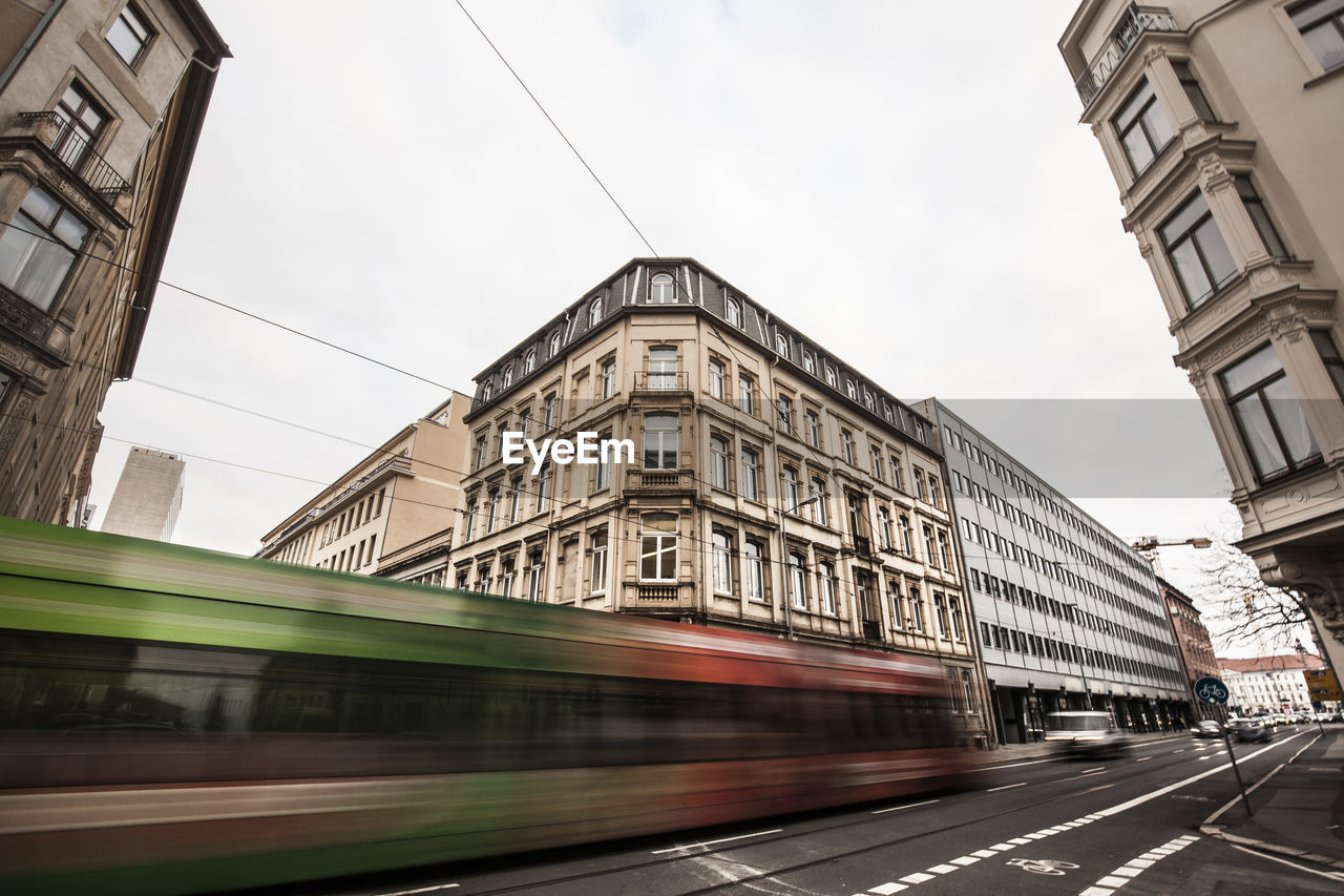 Blurred motion of cable car in city