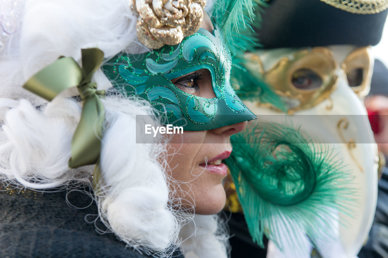 Close-up of person wearing venetian mask