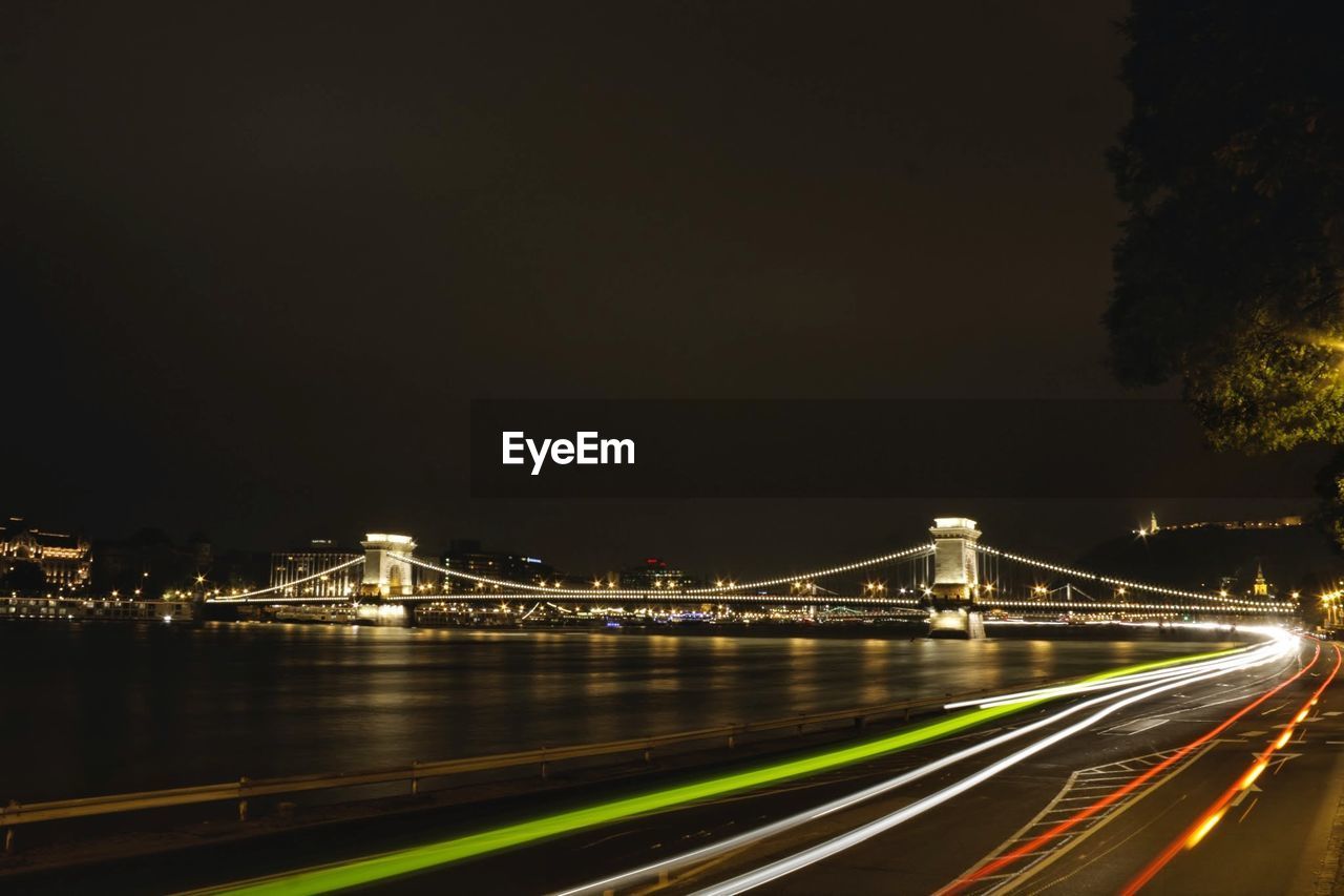 Light trails on suspension bridge at night