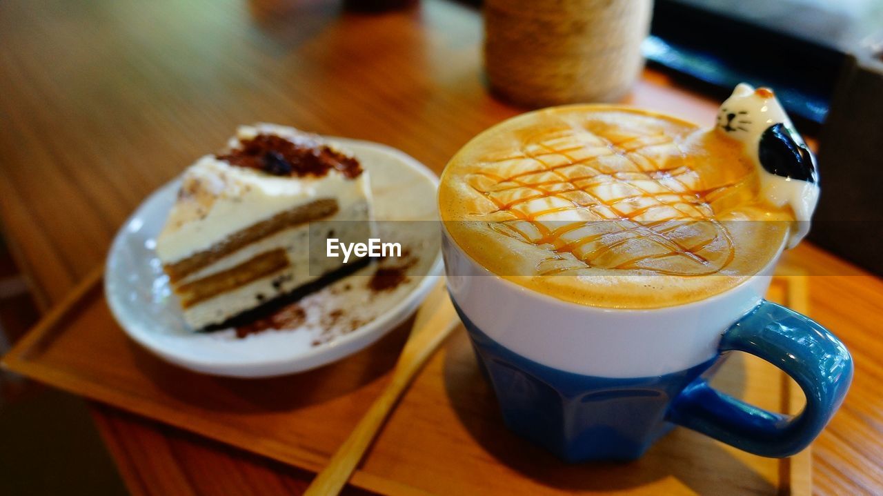 Close-up of cappuccino served on table