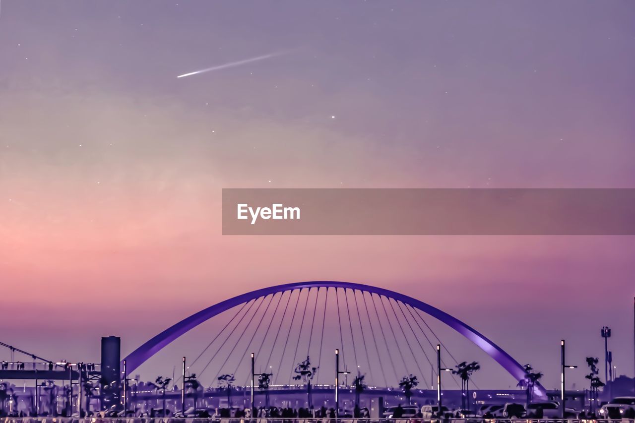 FERRIS WHEEL AGAINST SKY DURING SUNSET