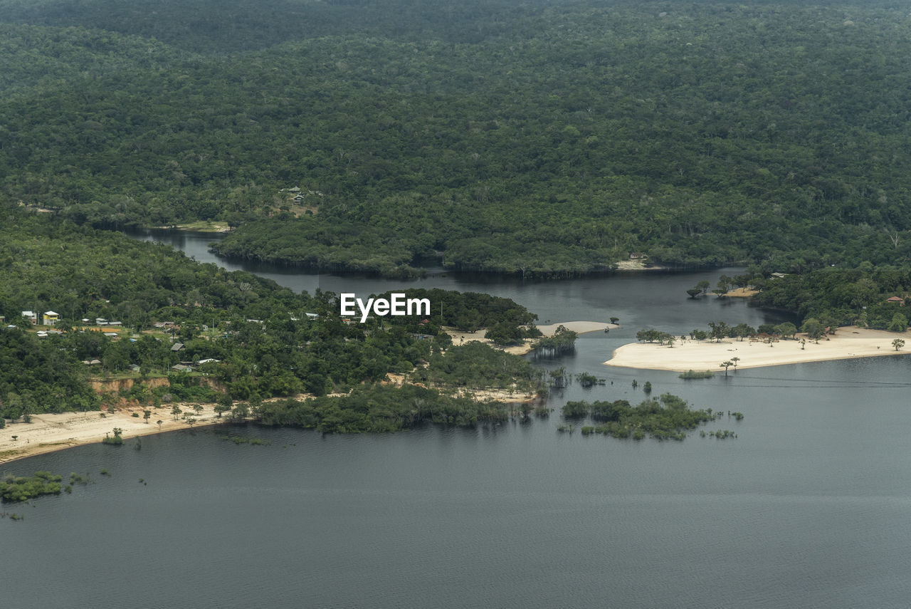 Beautiful aerial view to green flooded rainforest and river beach