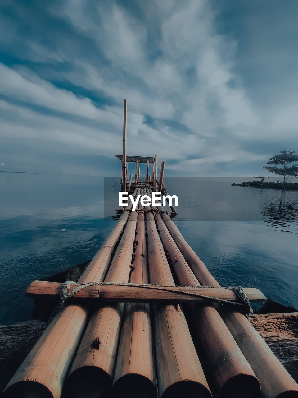 water, cloud, sky, sea, nature, vehicle, nautical vessel, ocean, no people, boat, scenics - nature, beauty in nature, reflection, transportation, wood, outdoors, day, blue, architecture, tranquility, watercraft, tranquil scene, environment