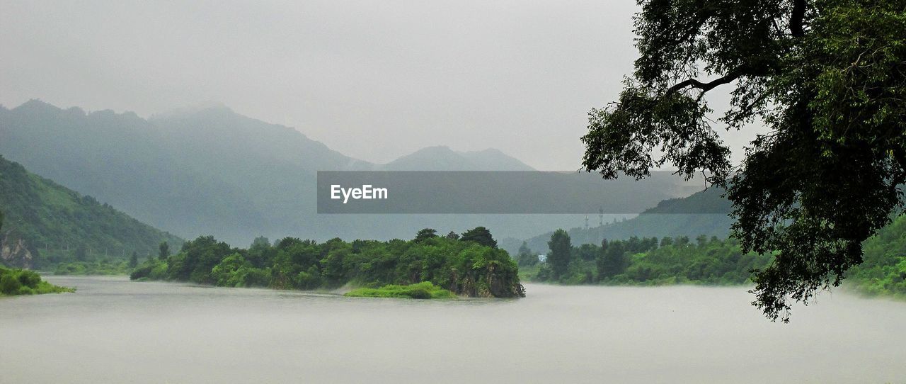 Scenic view of river against mountains