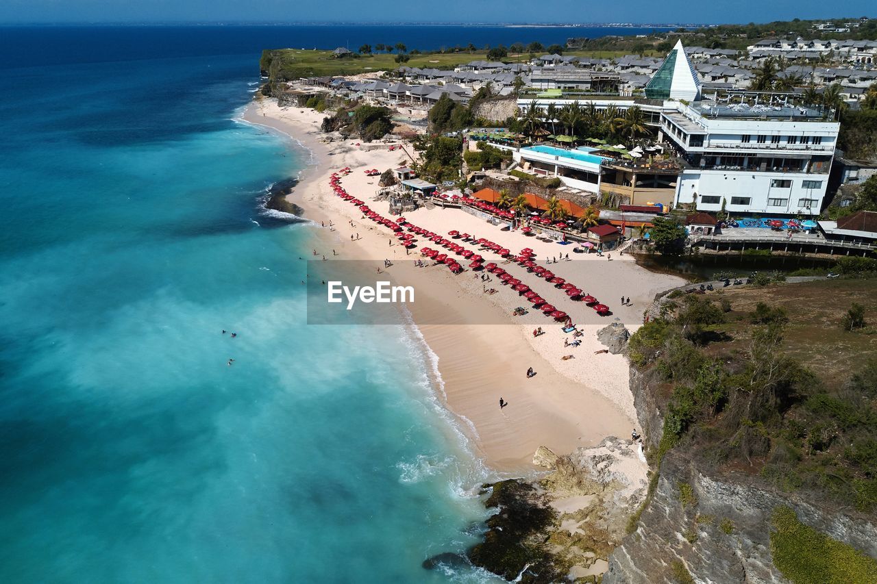 HIGH ANGLE VIEW OF BUILDINGS BY SEA