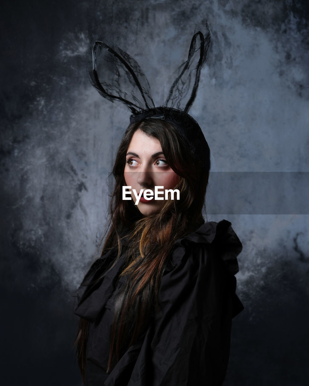 darkness, portrait, long hair, one person, women, adult, hairstyle, young adult, looking at camera, fantasy, black, fashion, clothing, studio shot, dark, female, indoors, brown hair, witch, mystery, gothic style, make-up, evil, human hair, serious, spooky, goth subculture, gray, gray background, waist up, costume