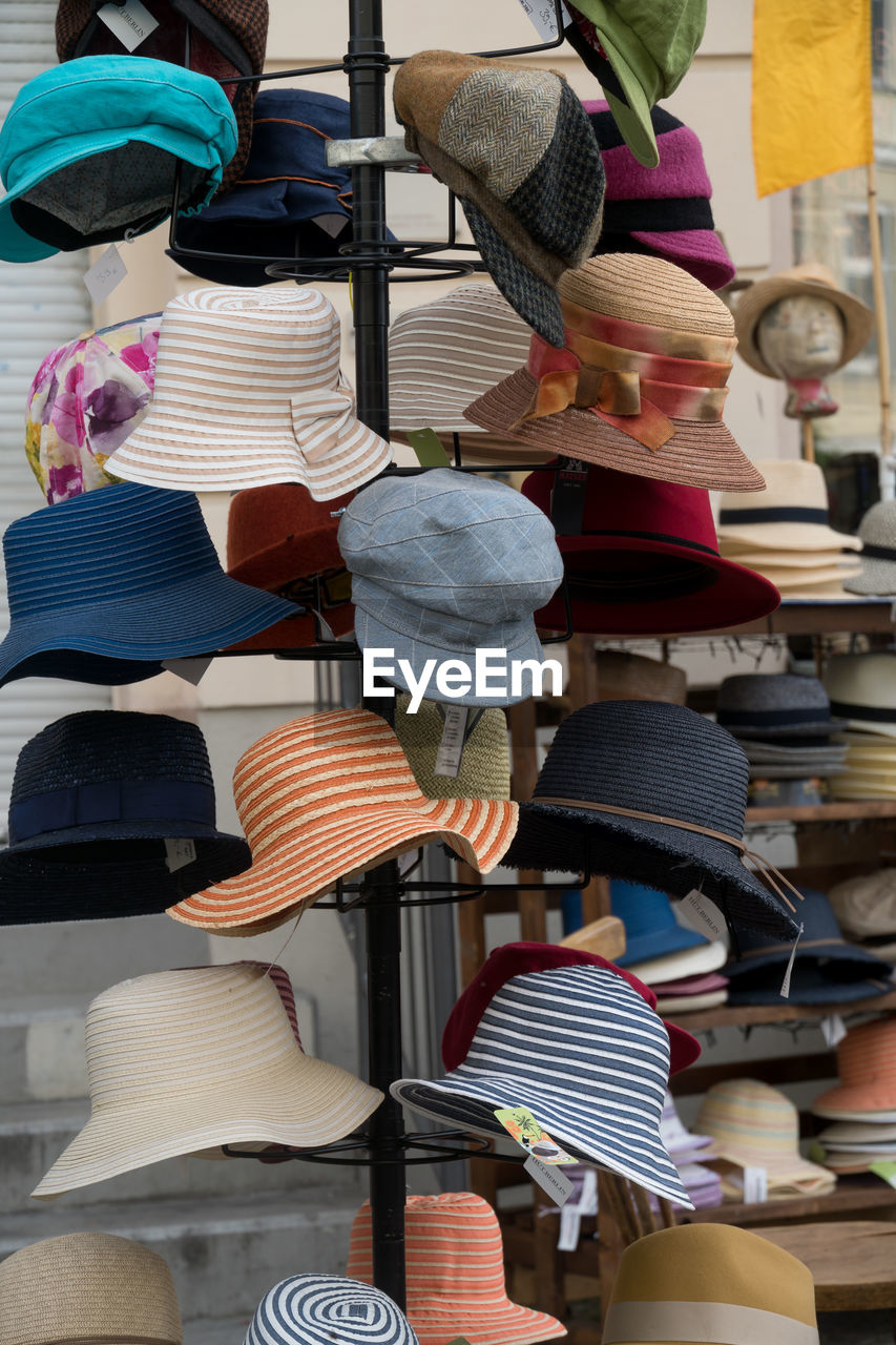 CLOTHES HANGING IN MARKET STALL FOR SALE