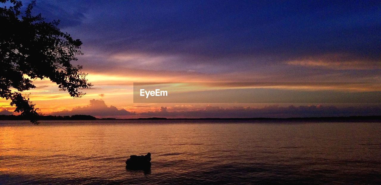 SCENIC VIEW OF SEA DURING SUNSET