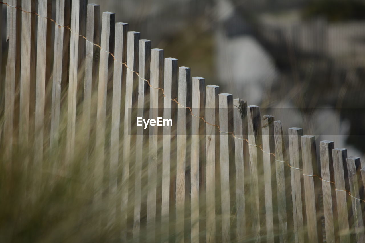 Wooden fence on field