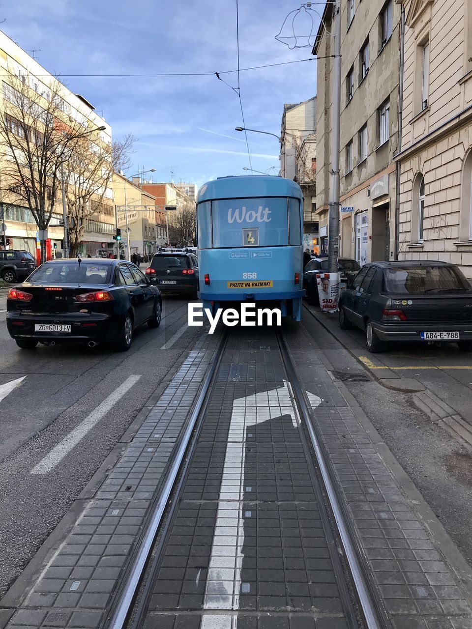 CARS ON ROAD IN CITY