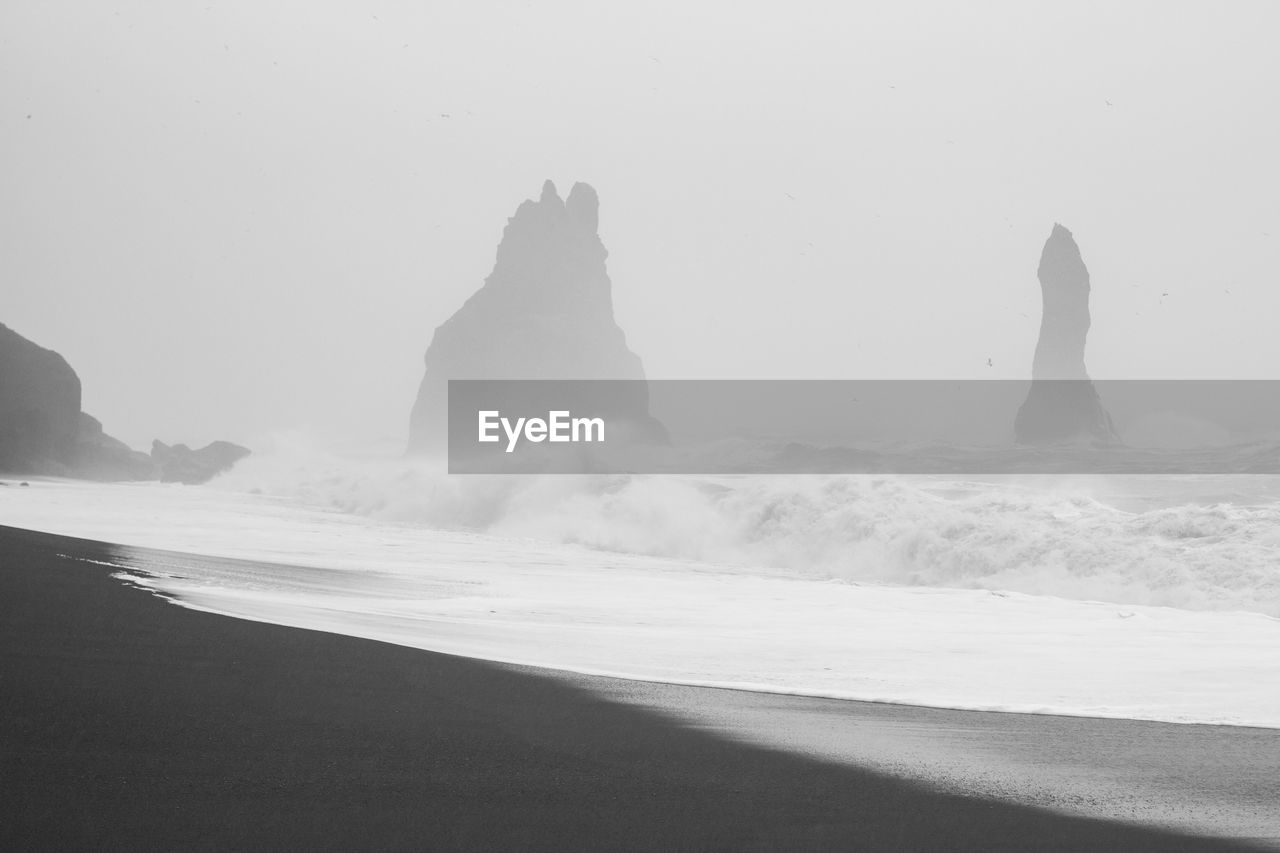 Spicky cliffs on stormy day monochrome landscape photo