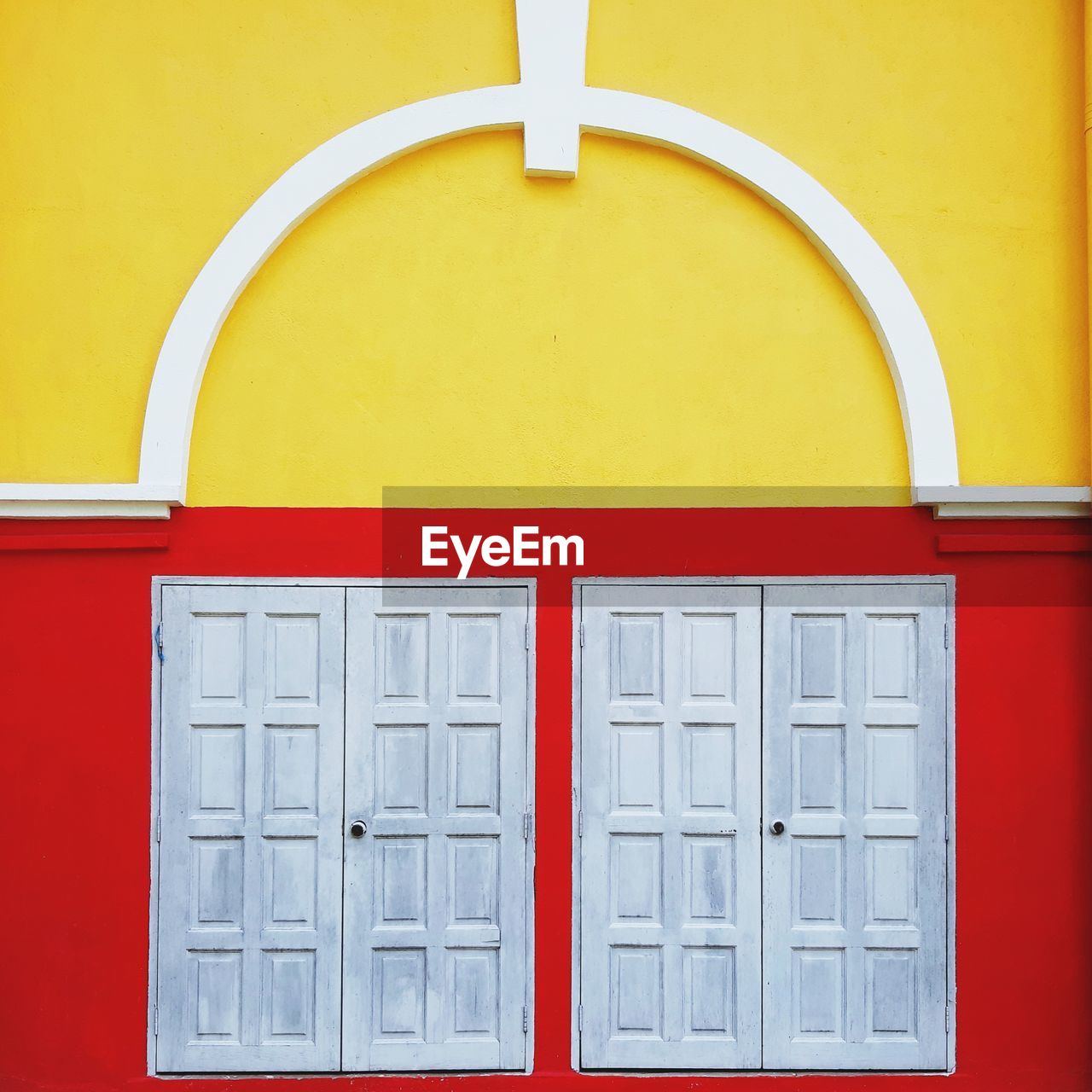 CLOSE-UP OF YELLOW BUILDING