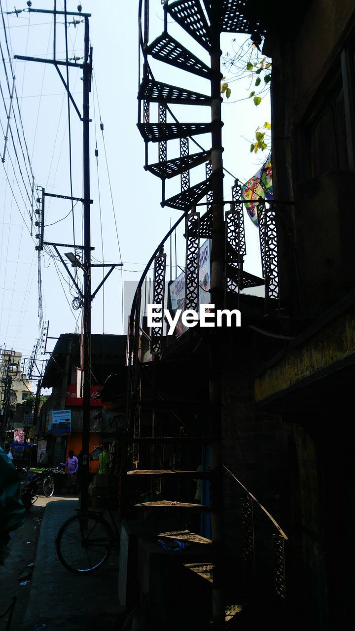 LOW ANGLE VIEW OF STAIRCASE AGAINST SKY