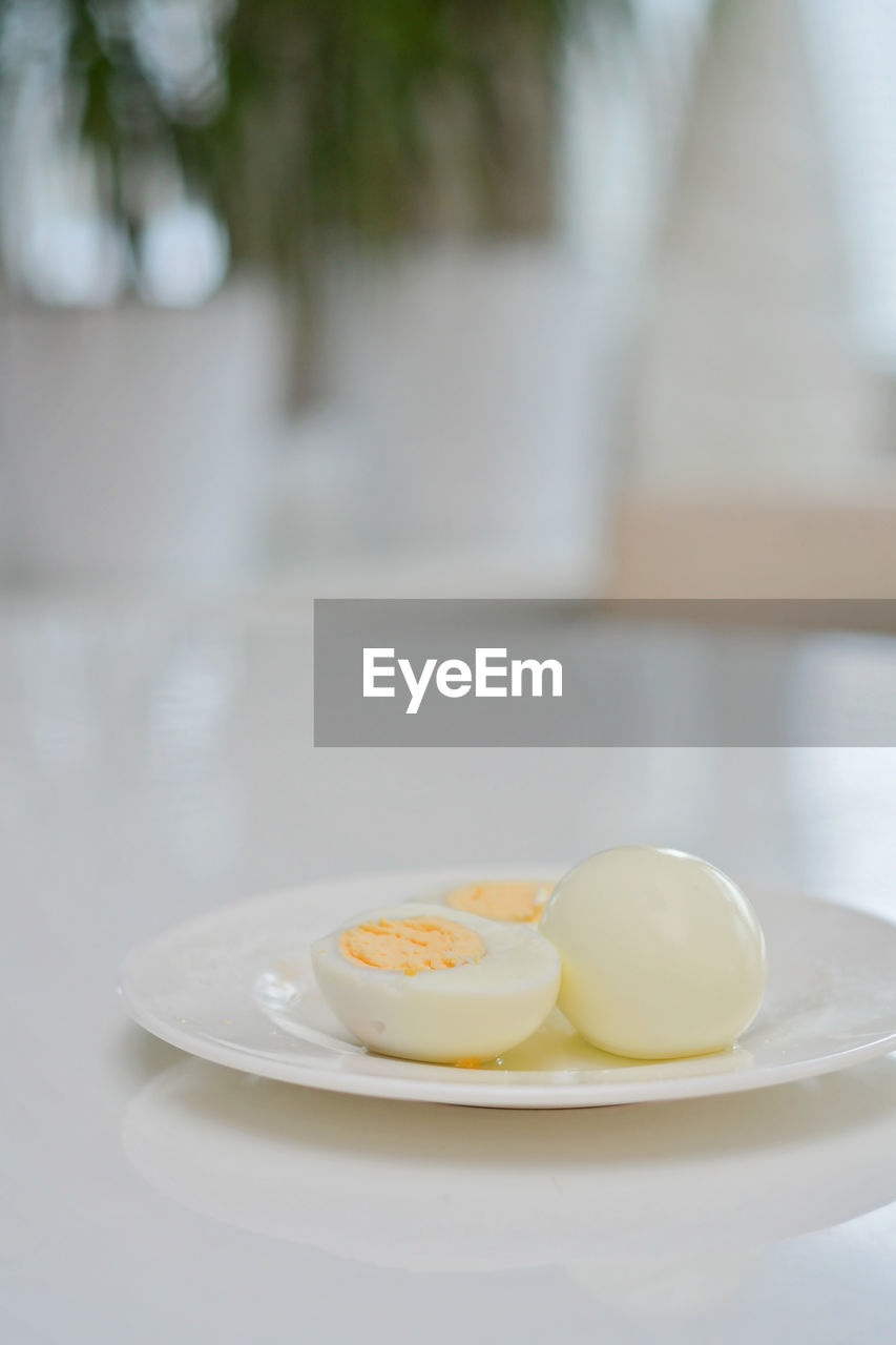 food and drink, food, egg, plate, healthy eating, wellbeing, freshness, egg yolk, focus on foreground, no people, table, meal, breakfast, indoors, dishware, close-up, tableware, white, produce, day, fried egg, kitchen utensil, still life