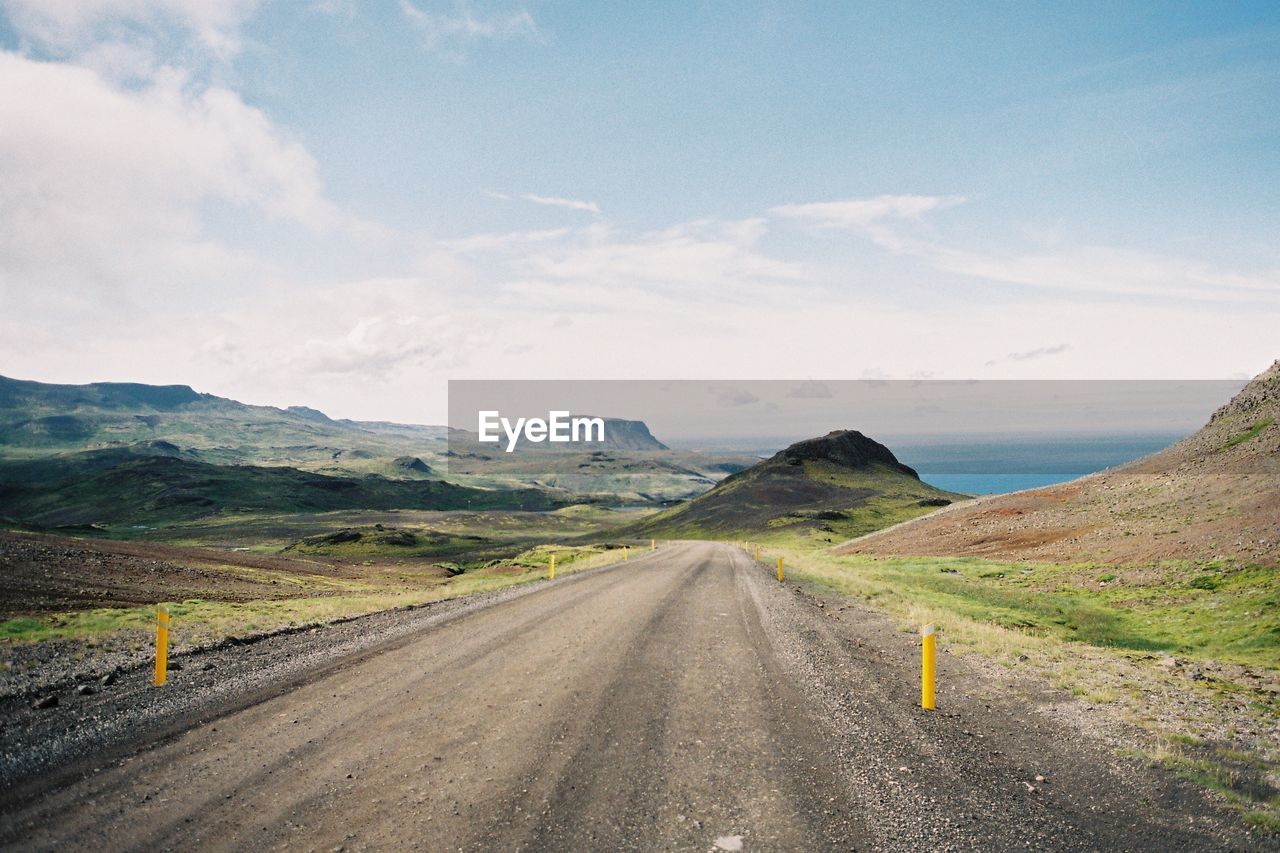 ROAD LEADING TOWARDS MOUNTAINS