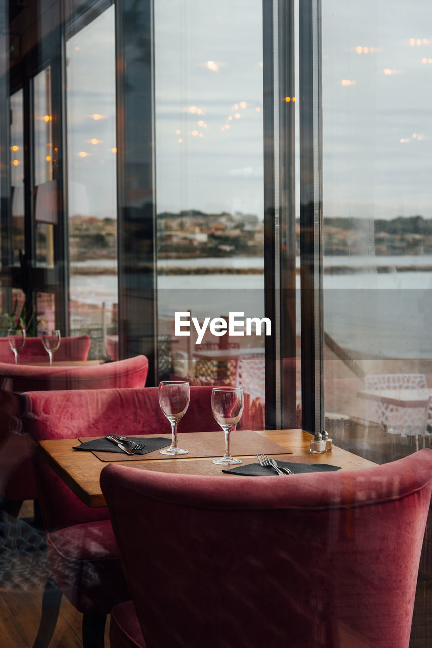 Glass of restaurant table by window. 