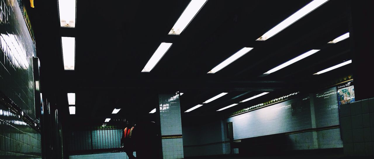 Men talking at subway station