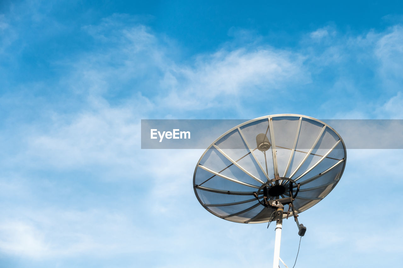 Low angle view of satellite dish against blue sky