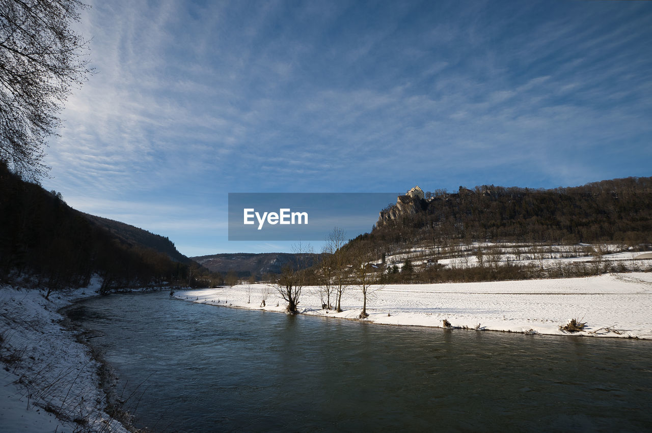 Scenic view of river valkey against sky during winter