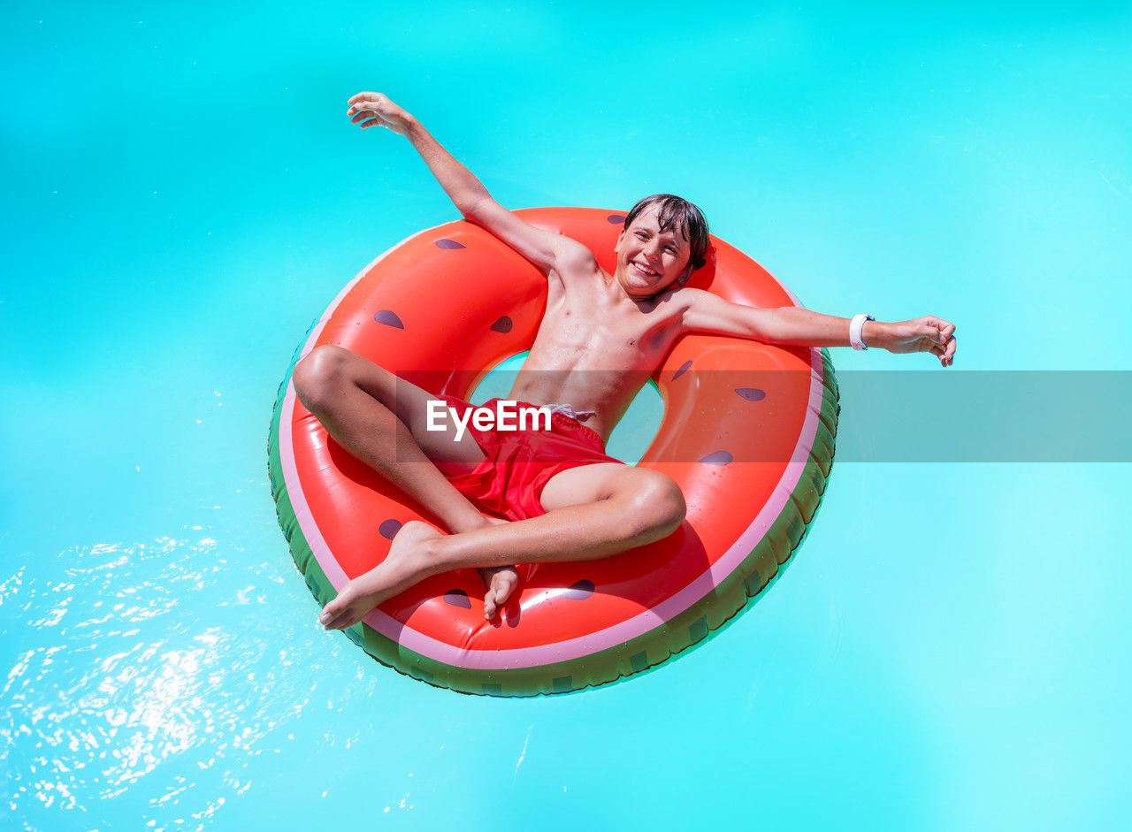 high angle view of woman swimming in sea