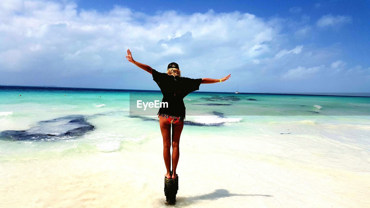 Woman standing on beach