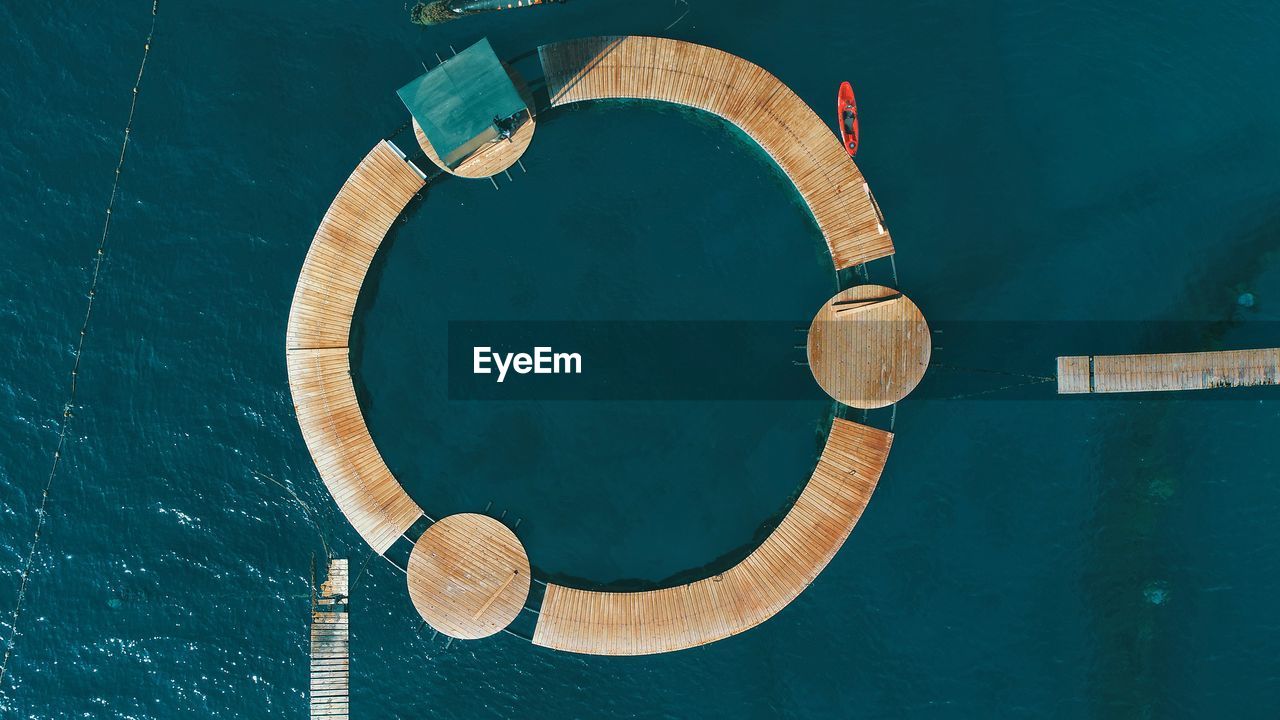 Aerial view of circular pier over sea