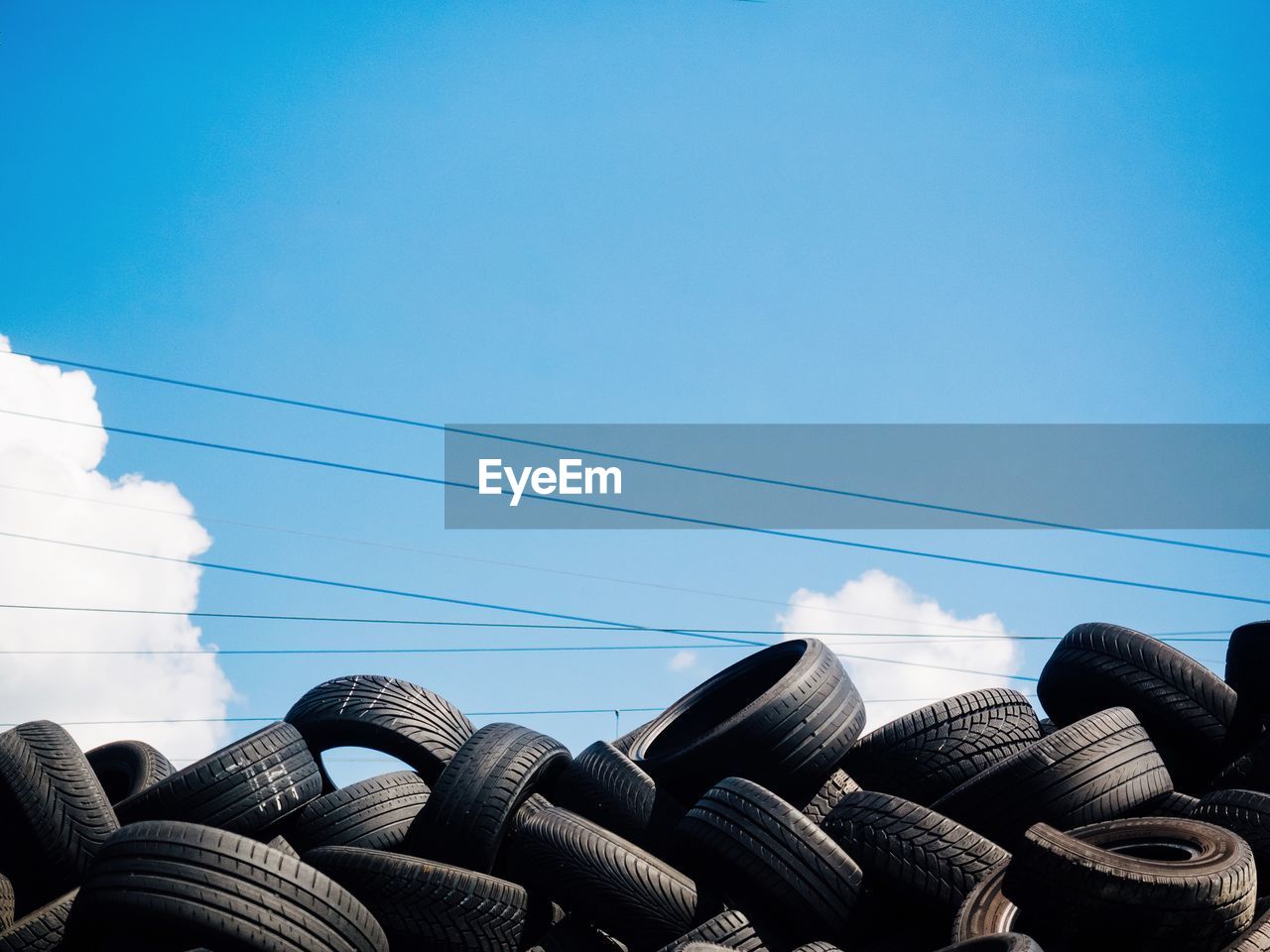 LOW ANGLE VIEW OF CABLES AGAINST CLEAR SKY