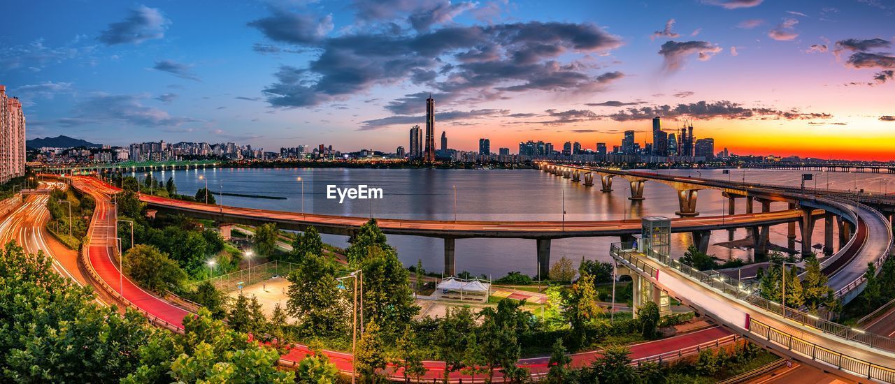 PANORAMIC VIEW OF BRIDGE OVER RIVER AGAINST SKY