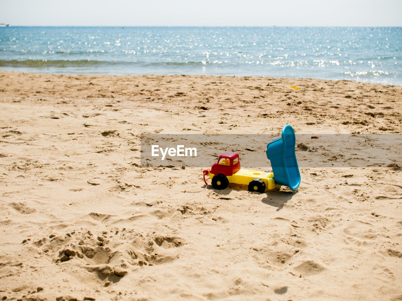 TOY CAR ON BEACH