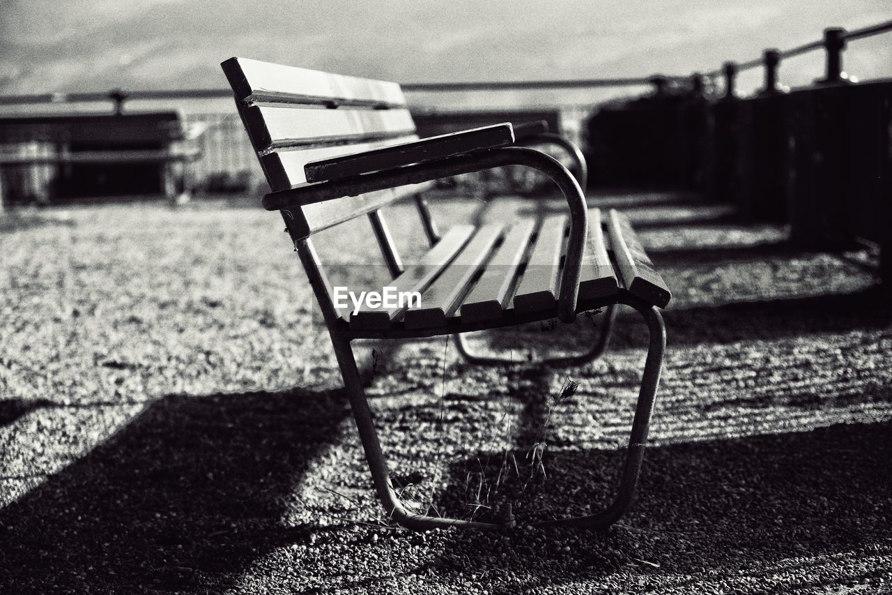 Empty bench on field