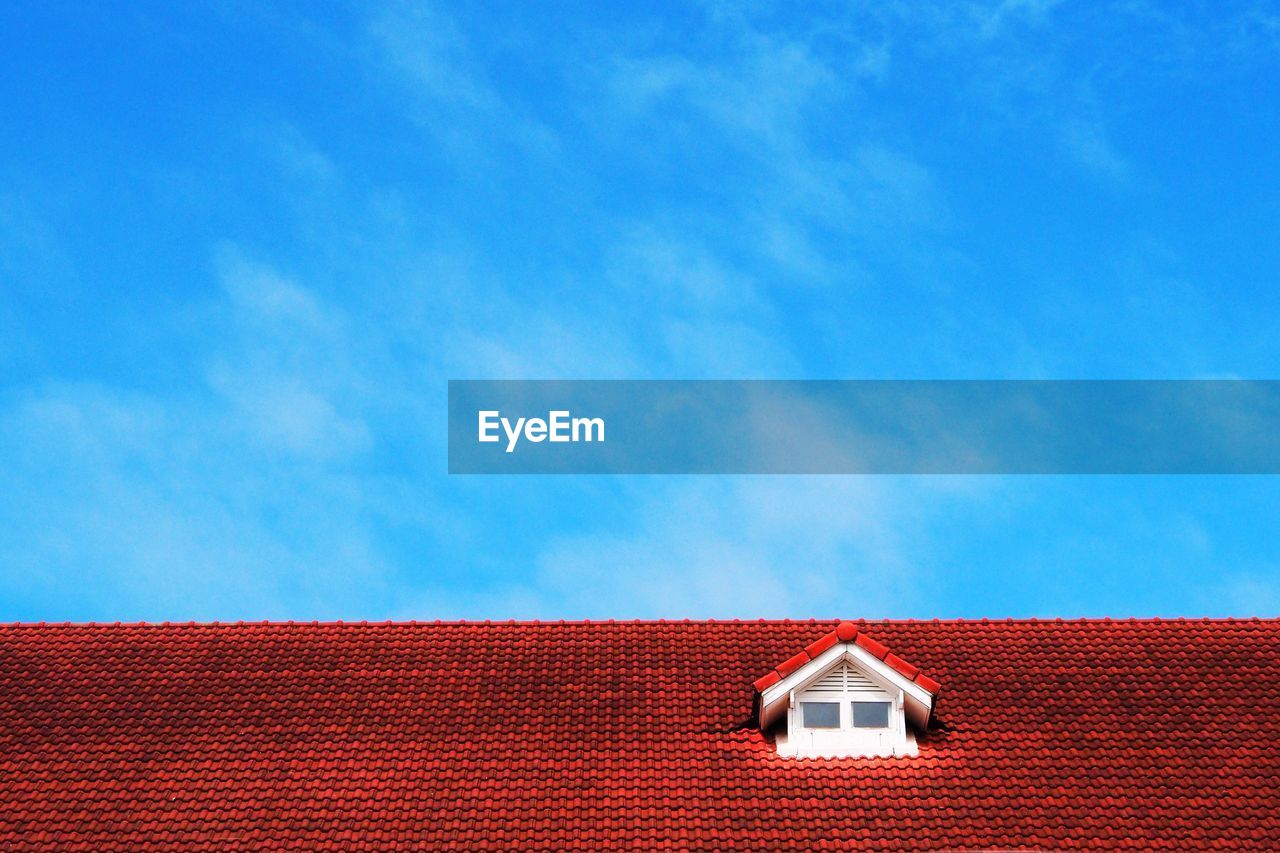 Low angle view of house against blue sky