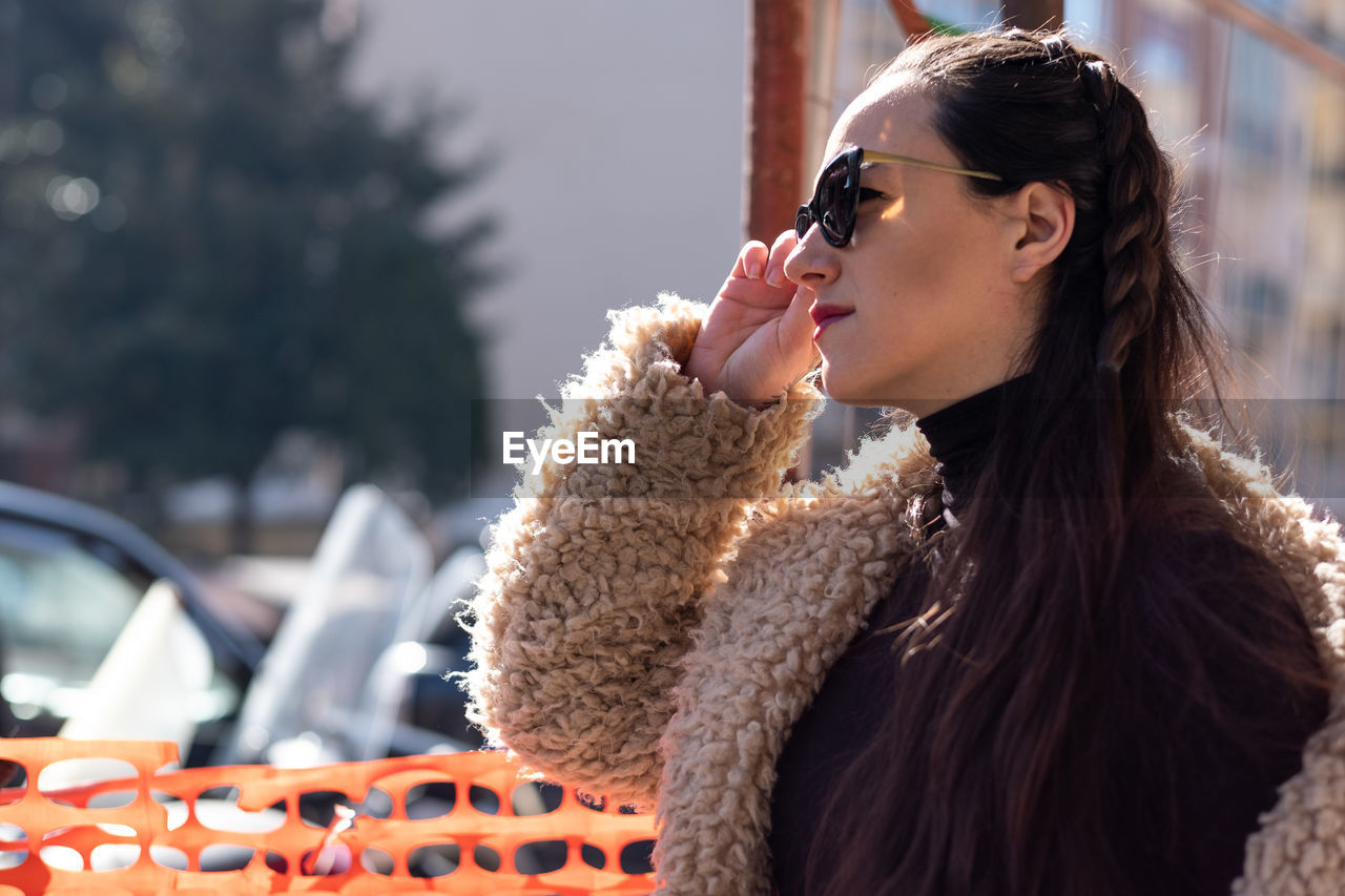 Young woman wearing sunglasses