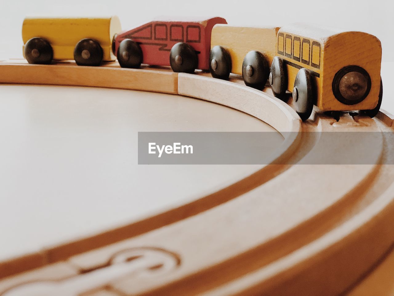 Close-up of toy trains against white background