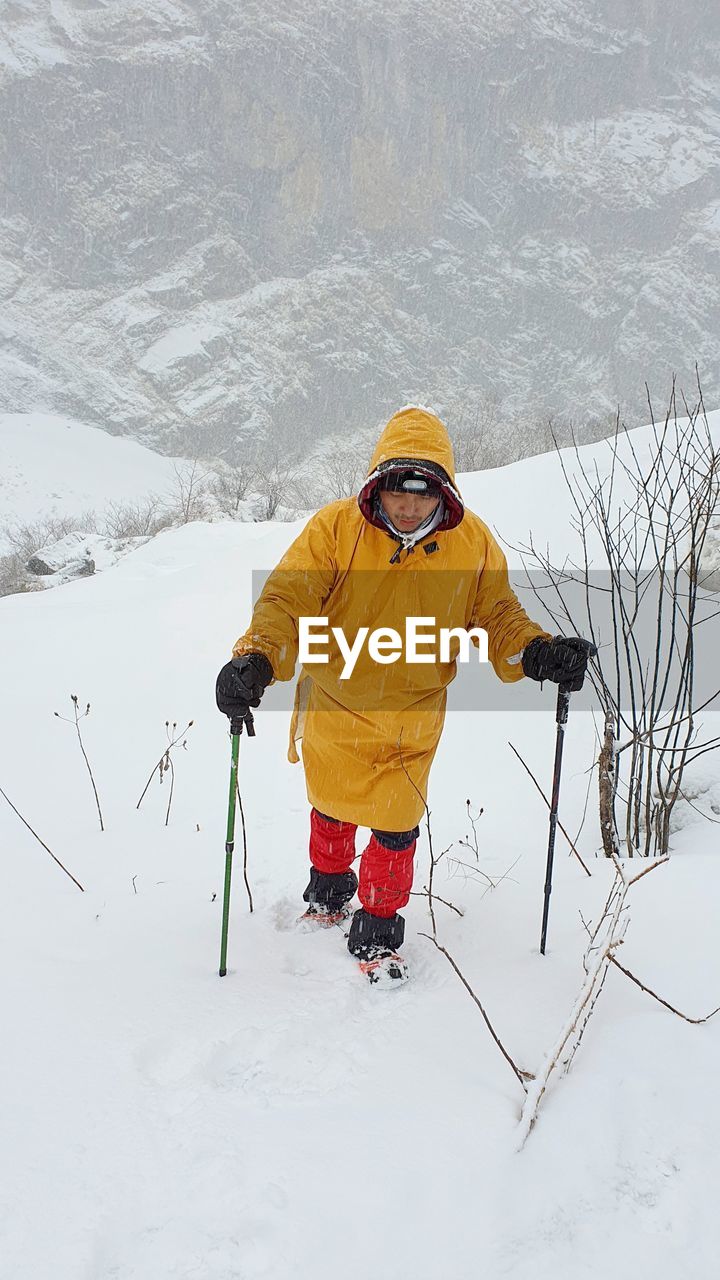 Man on snow covered field