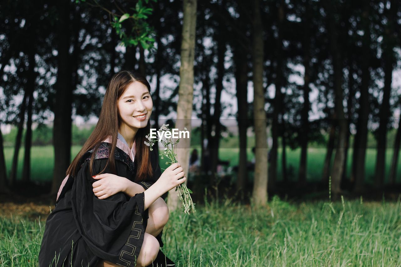 Portrait of young woman in forest