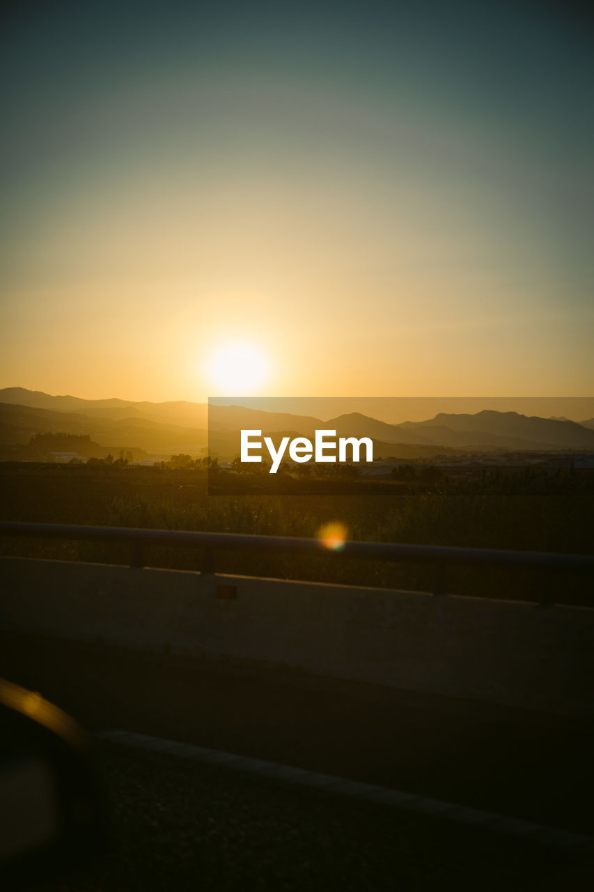 Scenic view of landscape against sky during sunset