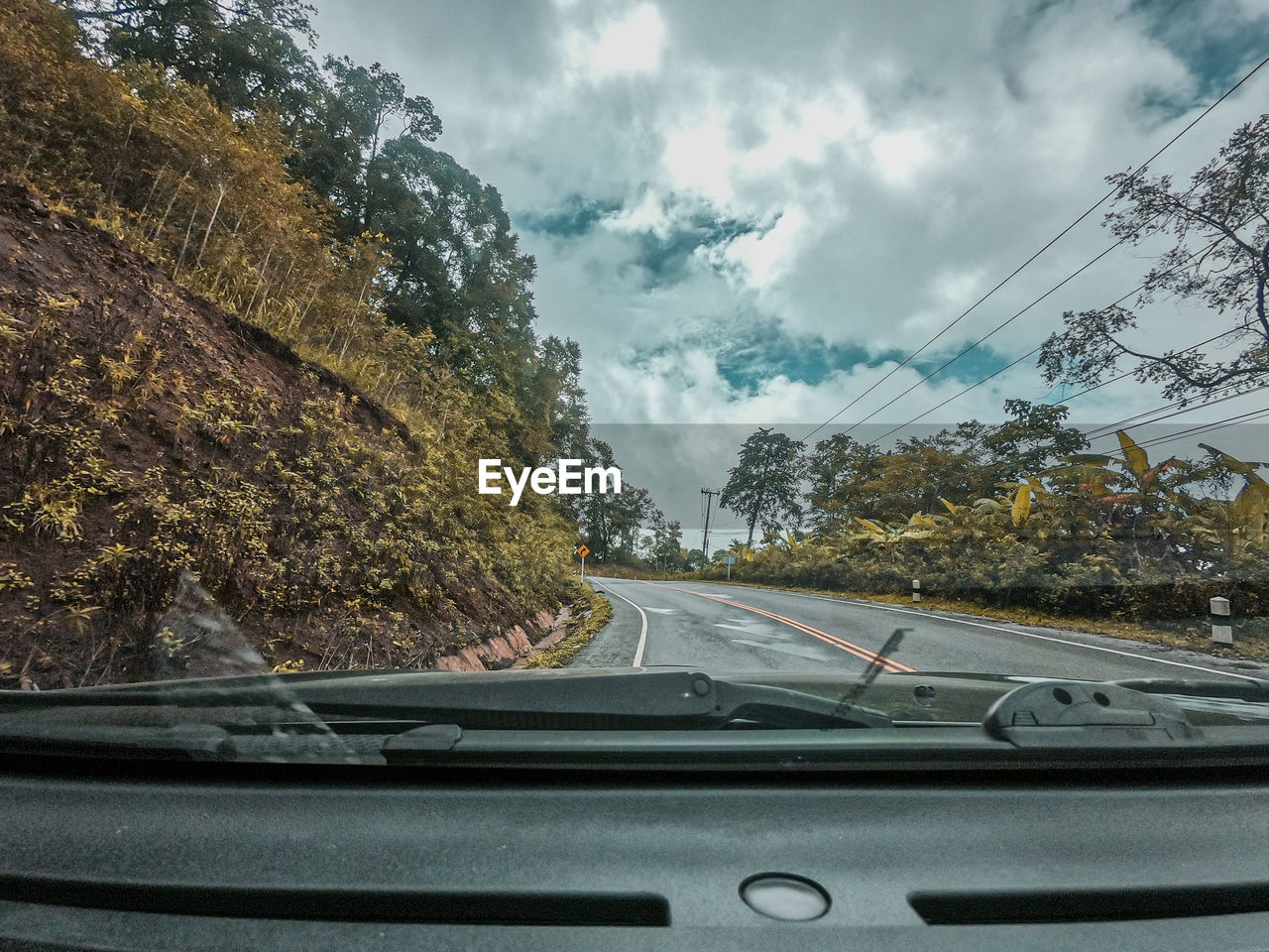 CARS ON ROAD SEEN THROUGH WINDSHIELD