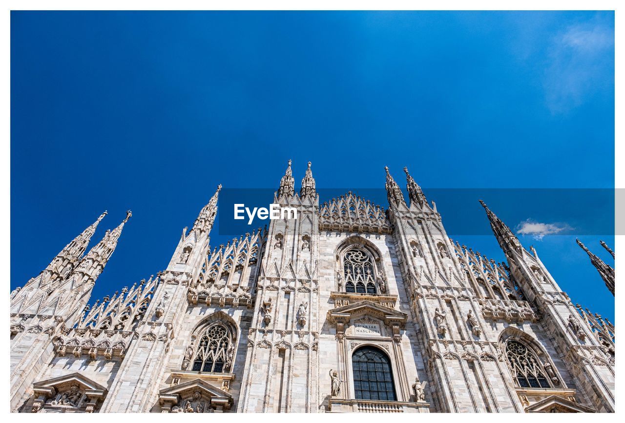 Low angle view of milano cathedral against sky