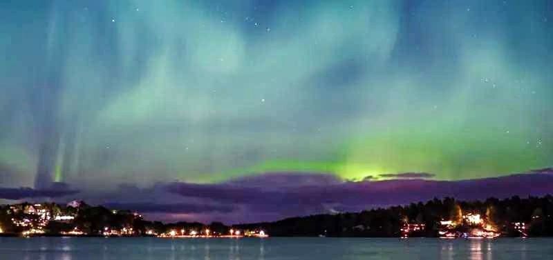 VIEW OF ILLUMINATED LAKE AT NIGHT