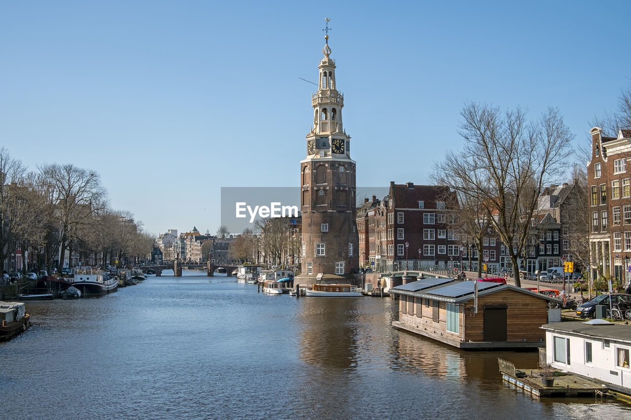 City scenic from amsterdam in the netherlands with the montelbaan tower